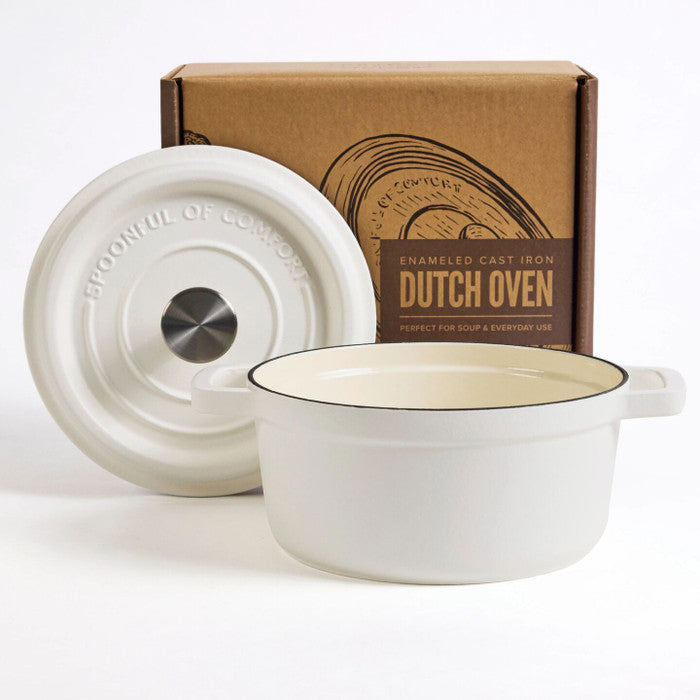 White enameled cast iron Dutch oven with lid displayed in front of its packaging box labeled âDutch Oven.â